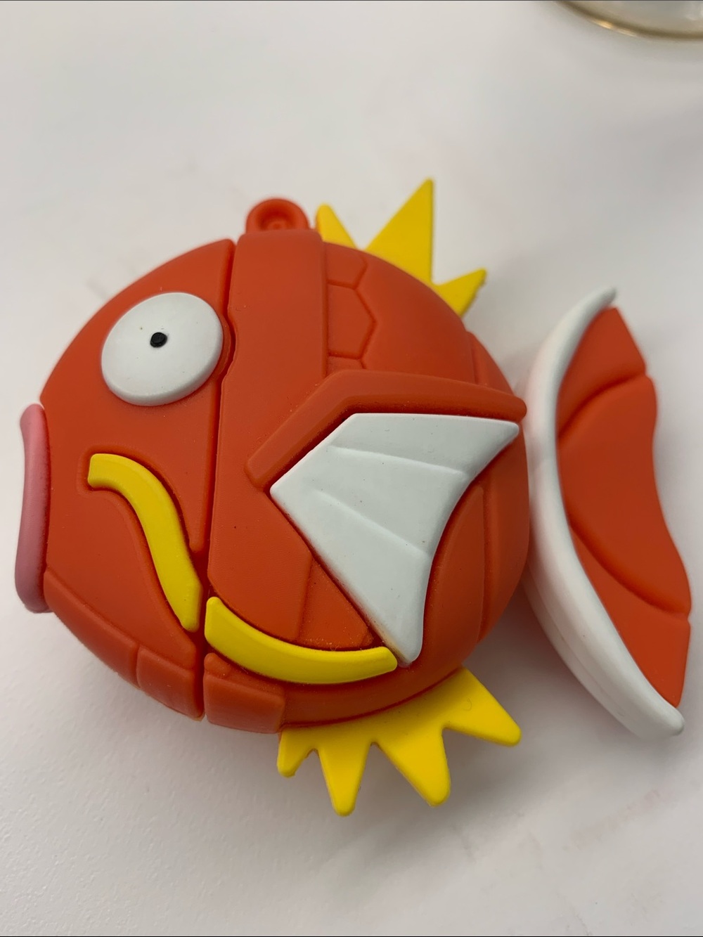 Reformation Orange Silicone Fish Keychain Case with White and Yellow Accents